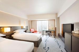 Postel nebo postele na pokoji v ubytování Hilton Tokyo Hotel
