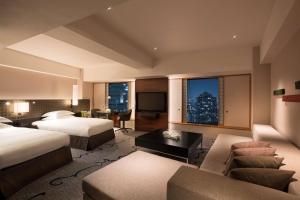 Postel nebo postele na pokoji v ubytování Hilton Tokyo Hotel