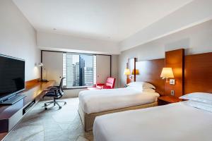 Postel nebo postele na pokoji v ubytování Hilton Tokyo Hotel + 37 fotografií