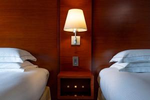 Postel nebo postele na pokoji v ubytování Hilton Tokyo Hotel