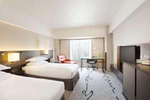 Postel nebo postele na pokoji v ubytování Hilton Tokyo Hotel