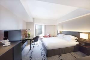 Postel nebo postele na pokoji v ubytování Hilton Tokyo Hotel