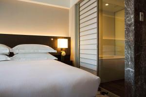 Postel nebo postele na pokoji v ubytování Hilton Tokyo Hotel