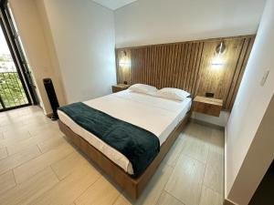 Postel nebo postele na pokoji v ubytování Amara404 Lindo apartaestudio tipo estudio en barrio Laureles con balcon