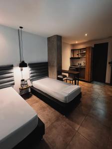 Postel nebo postele na pokoji v ubytování Apartahotel con Piscina