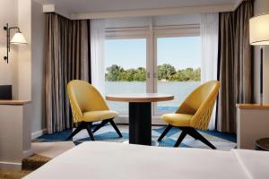 Hilton Vienna Waterfront客房内的一张或多张床位