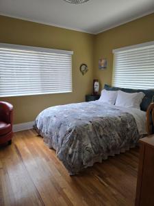 En eller flere senge i et værelse på The Ginkgo House