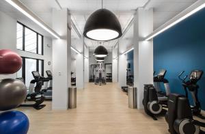 a gym with treadmills and elliptical machines at Hilton Orlando Buena Vista Palace - Disney Springs Area in Orlando