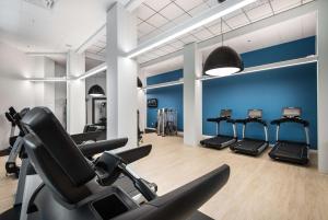 a gym with cardio machines and a row of treadmills at Hilton Orlando Buena Vista Palace - Disney Springs Area in Orlando
