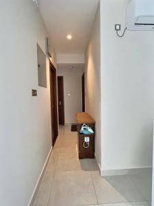 a hallway of a hospital room with a sink at Pearly Breeze Guest Room in Dehiwala