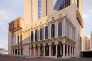 a building with tall buildings in a city at Hilton Hotel & Convention Jabal Omar Makkah in Mecca