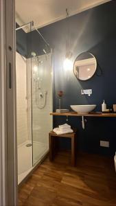 a bathroom with a glass shower and a sink at SalutieBaci in Lerici