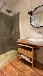 a bathroom with a sink and a shower at SalutieBaci in Lerici