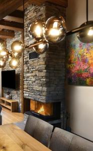 TV a/nebo společenská místnost v ubytování Chalet Oasis - Luxusná chata s výhľadom, pri Zuberci a Kvačianskej doline