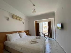 Postel nebo postele na pokoji v ubytování Cam Hotel + 37 fotografií