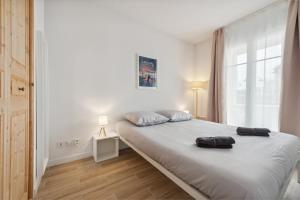 Postel nebo postele na pokoji v ubytování Le Coeur du Port Guillaume 4 pers