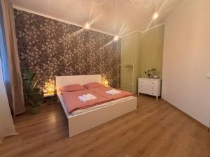 En eller flere senge i et værelse på Apartmán Spinačka