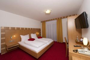 Postel nebo postele na pokoji v ubytování Pension Appartement Lanzer