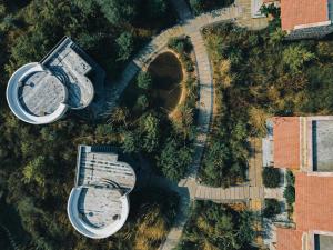 an overhead view of two buildings and trees at Sariska Lodge in Tehla