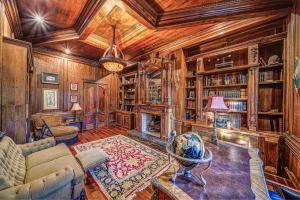 a living room with a couch and a fireplace at 9-Bedroom Atlanta Mansion for Rentals and Events in Marietta