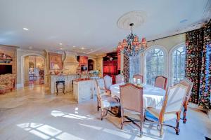 a kitchen and dining room with a table and chairs at 9-Bedroom Atlanta Mansion for Rentals and Events in Marietta