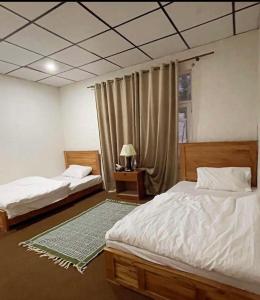 Postel nebo postele na pokoji v ubytování Hotel Destiny Skardu