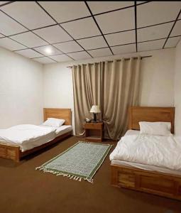 Postel nebo postele na pokoji v ubytování Hotel Destiny Skardu