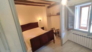 A bed or beds in a room at Ca La Palmira