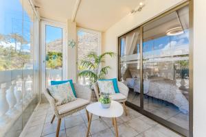 a room with a view of a bedroom at Ocean Terrace Apartment in Los Cristianos