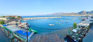 a large body of water with boats in it at Opal Apartments Luxury by the Sea in Hersonissos +42 photos