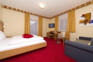 Postel nebo postele na pokoji v ubytování Pension Appartement Lanzer