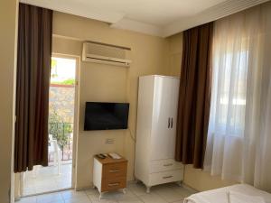 TV a/nebo společenská místnost v ubytování Cam Hotel