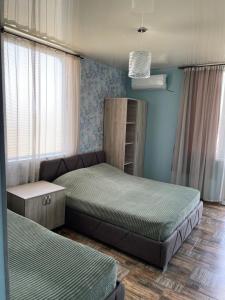 Postel nebo postele na pokoji v ubytování Hotel Kobuleti
