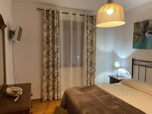 En eller flere senge i et værelse på Apartamento Margúz + 9 billeder