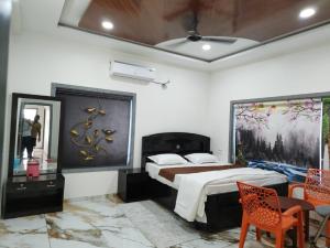 Krevet ili kreveti u jedinici u okviru objekta Rivaidhii inn rooms