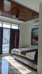 Krevet ili kreveti u jedinici u okviru objekta Rivaidhii inn rooms
