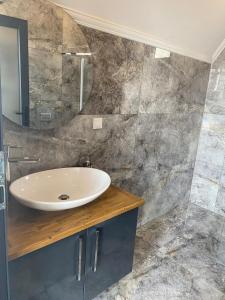 a bathroom with a sink and a mirror at Villa Işık in Kas