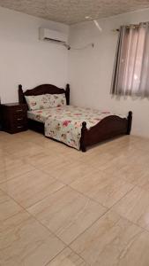 a bedroom with a bed and a dresser in it at Luxe lagoon guest house in Kasongha