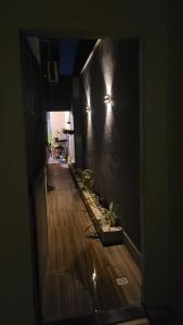 a view of a hallway with lights on the wall at Casa 3 Quartos in Ananindeua