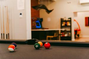 a group of billiard balls on a pool table at Stardust Big Bend Luxury A-Frame#1 with a fab view in Terlingua