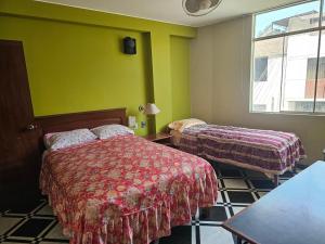 Postel nebo postele na pokoji v ubytování Hotel Atenas