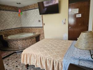 Postel nebo postele na pokoji v ubytování Hotel Atenas