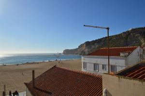 a view of the beach from the roofs of buildings at Porta 4 in Nazaré