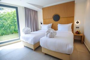 Voodi või voodid majutusasutuse FAHO Hôtel toas