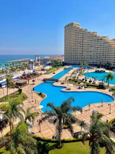 an aerial view of a resort with a large pool at Porto elsokhna pyramids in Ain Sokhna