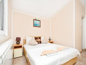 Postel nebo postele na pokoji v ubytování Apartments MIK5 - Famous Beach Jaz