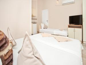 Postel nebo postele na pokoji v ubytování Apartments MIK5 - Famous Beach Jaz