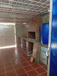 a kitchen with a pizza box on the floor at Townhouse en Chichiriviche AGUILA MARINA 3 in Chichiriviche