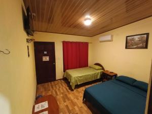 Katil atau katil-katil dalam bilik di Nambí Rooms