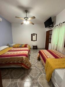 Cama ou camas em um quarto em Cabañas y Hostal Las Marias